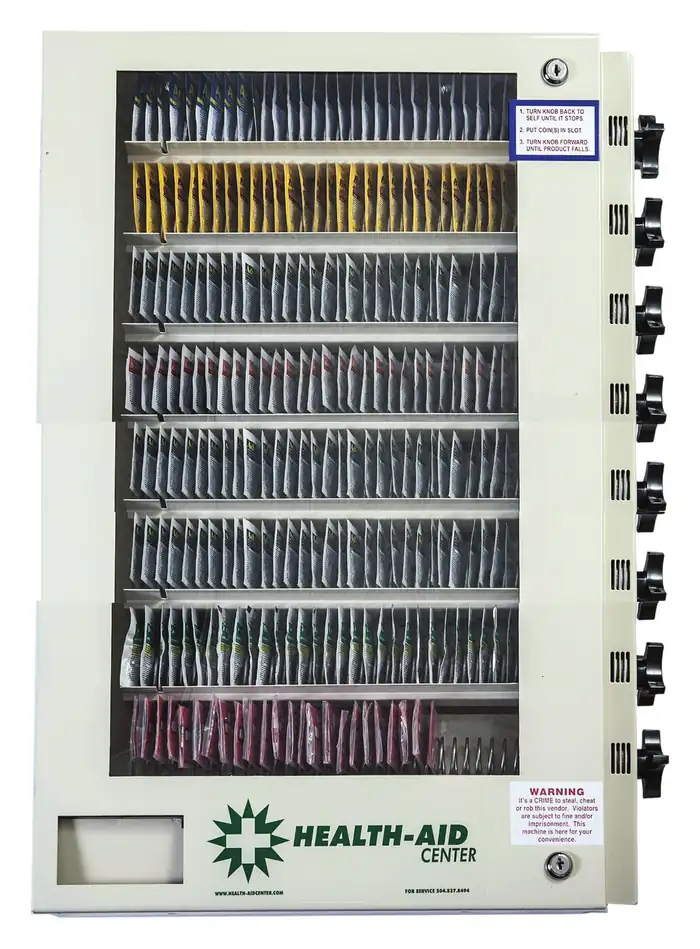 Health-Aid eight-select vending machine, front view, with eight coil rows of packeted product and eight selection knobs