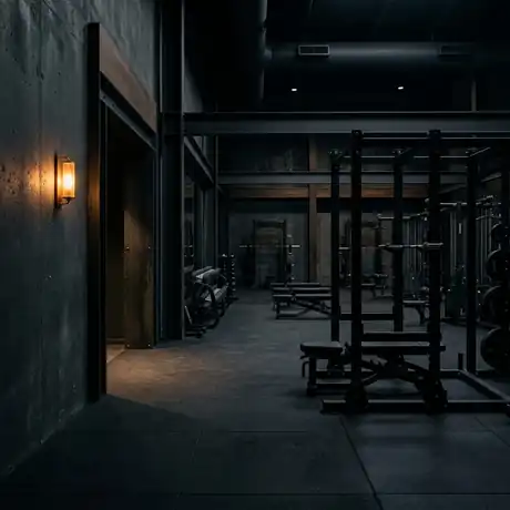 Moody premium gym interior with a warm amber entry light